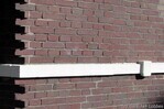 Detail gevel met natuurstenen band.
              <br/>
              Gert-Jan Lobbes, 2016